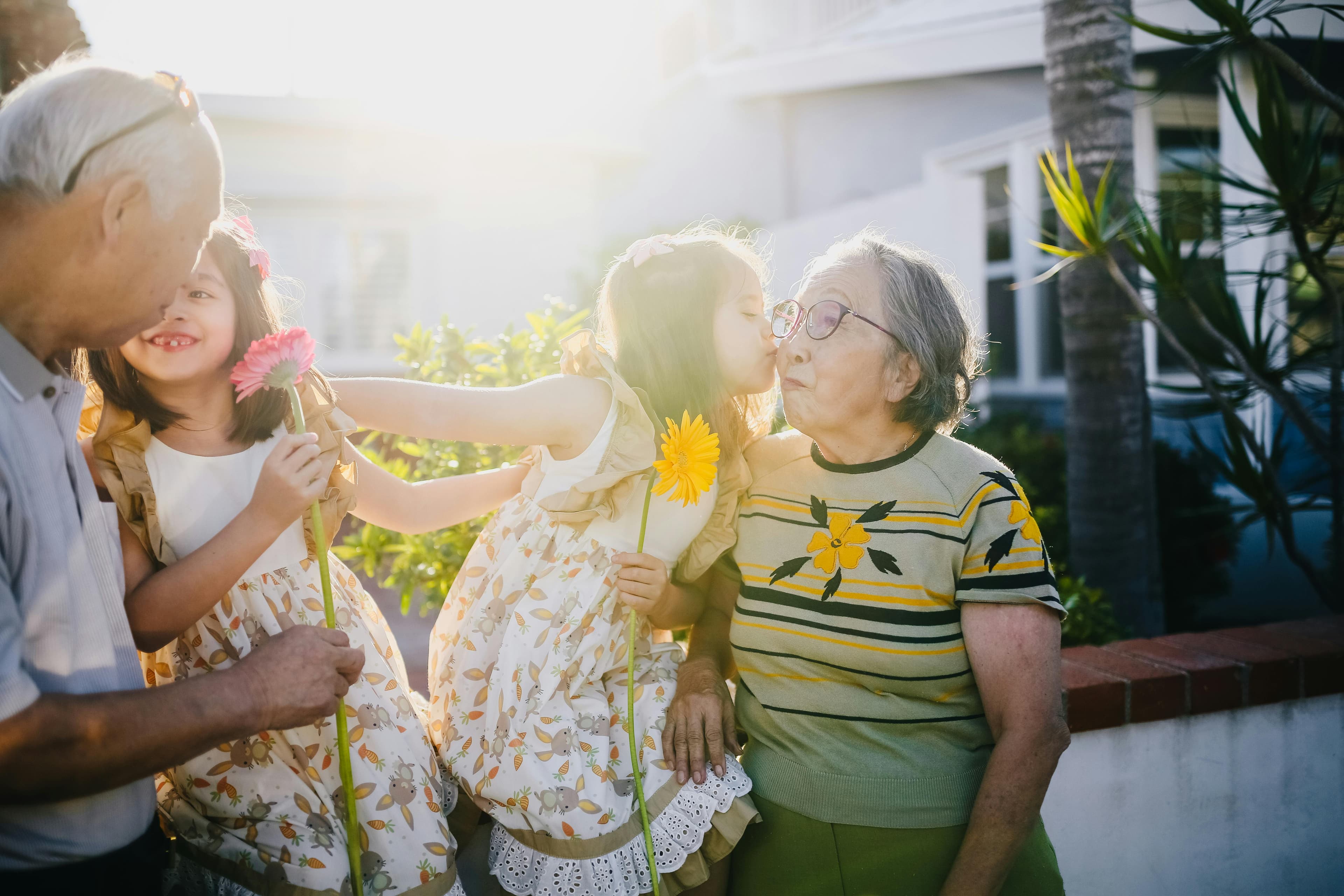 Grandparents with grandchildren sharing a moment outdoors
